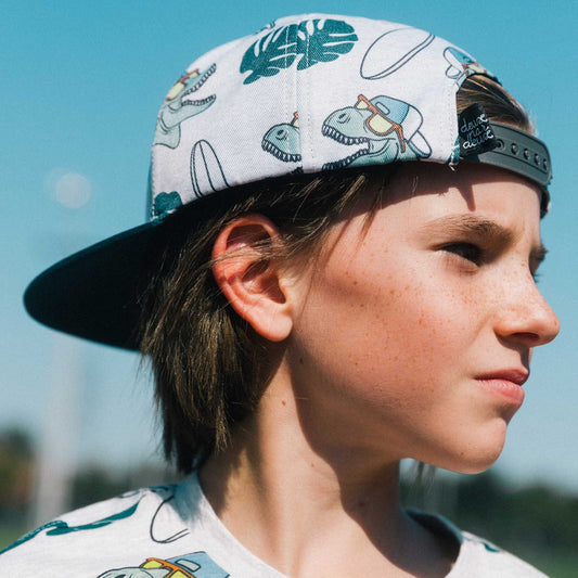 Boutique Petites Fleurs - Casquette imprimée dinosaures surf E30VC42